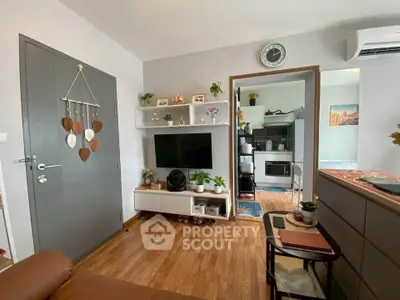 Cozy living room with modern decor and open kitchen layout