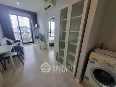 Modern apartment interior with washing machine and city view balcony