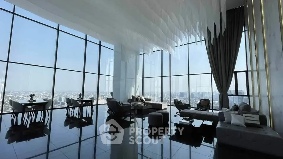 Luxurious penthouse living room with panoramic city views and modern furnishings.