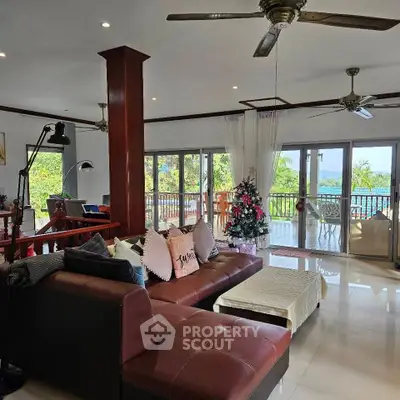 Spacious living room with modern decor and stunning balcony view