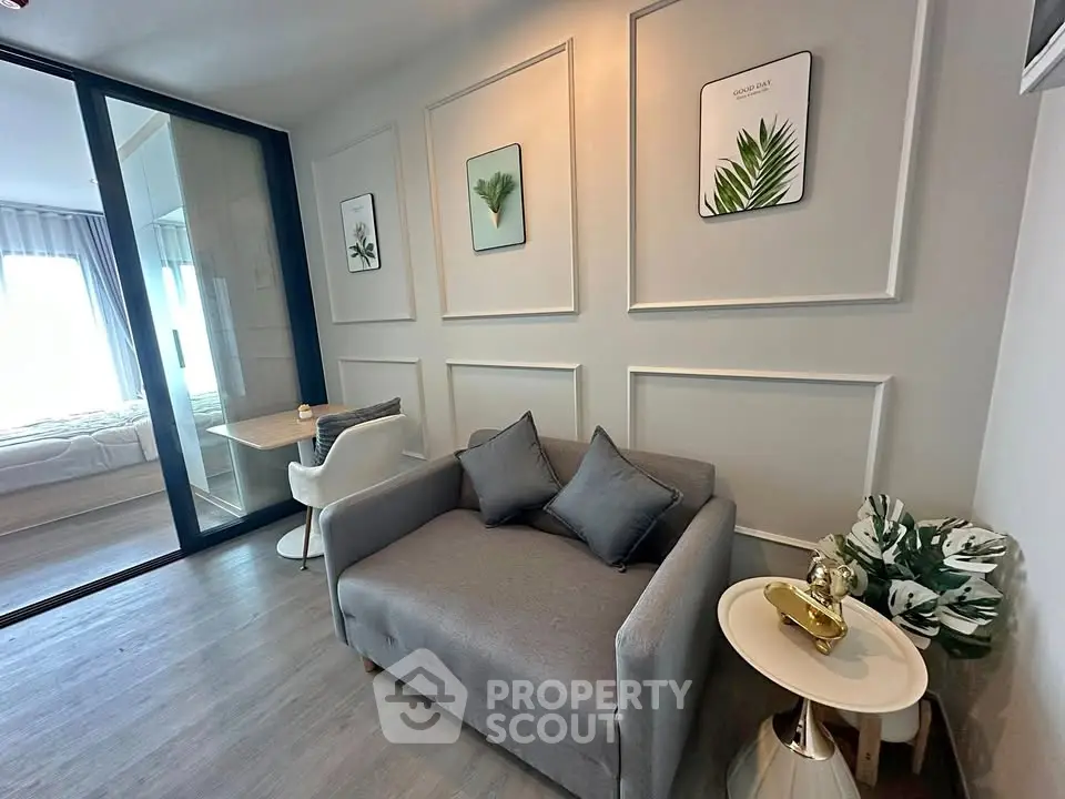 Modern living room with stylish decor and cozy seating in a contemporary apartment.