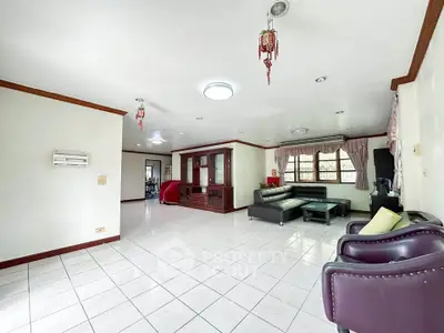 Spacious living room with modern furniture and large windows for natural light.