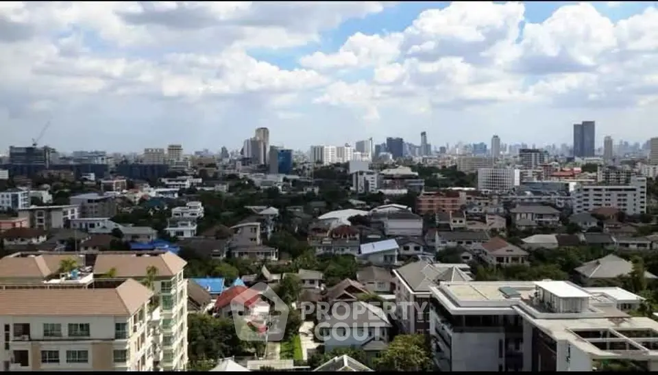 Stunning cityscape view showcasing diverse architecture and lush greenery.
