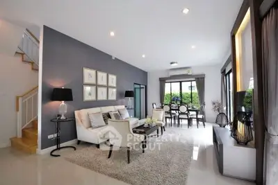 Spacious modern living room with elegant decor and ample natural light