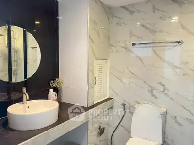 Modern bathroom with sleek design and marble tiles