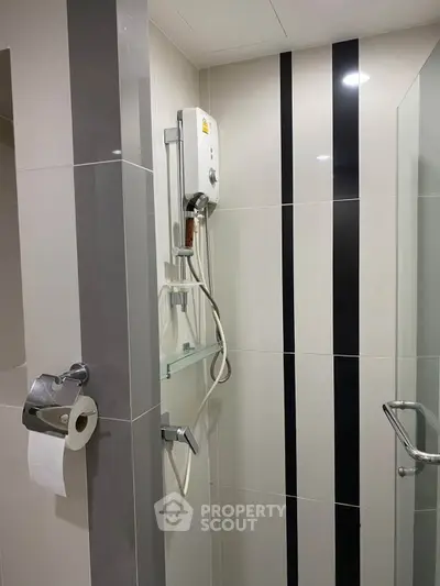 Modern bathroom with sleek shower design and stylish tile accents