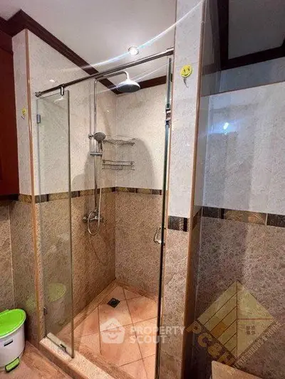 Luxurious bathroom with elegant shower enclosure and modern fixtures