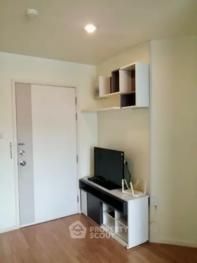 Modern living room with sleek TV stand and wall shelves