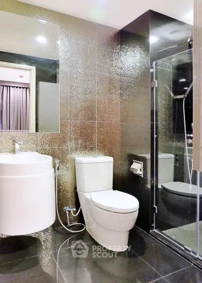 Luxurious modern bathroom with sleek fixtures and glass shower enclosure