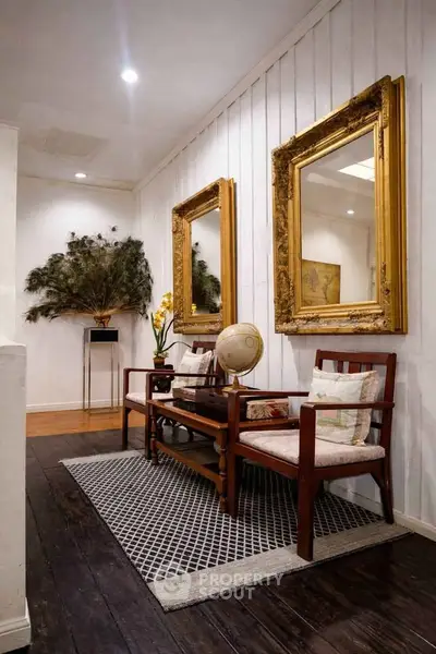 Charming hallway with elegant mirrors and vintage decor in a cozy home setting.