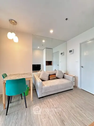 Modern living room with stylish decor and cozy seating in a contemporary apartment.