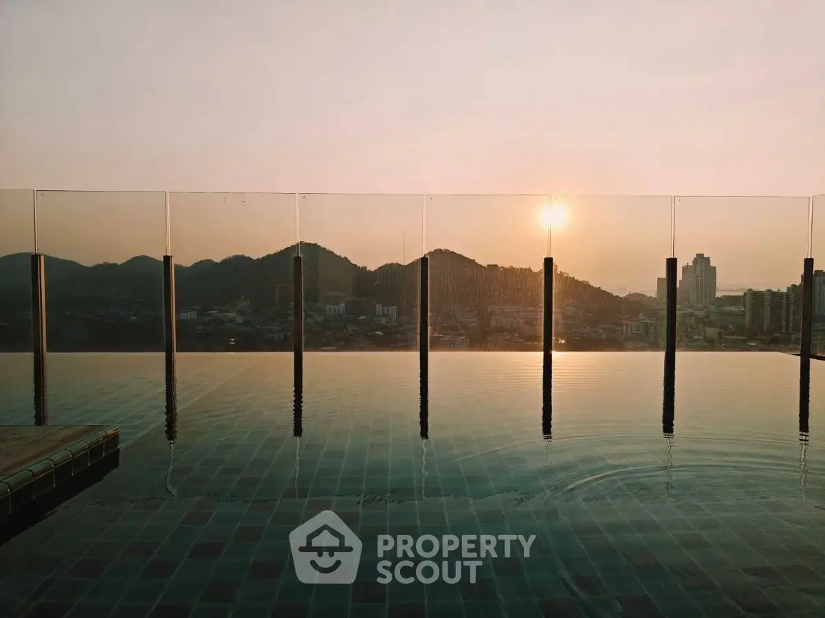 Stunning rooftop infinity pool with breathtaking sunset city view