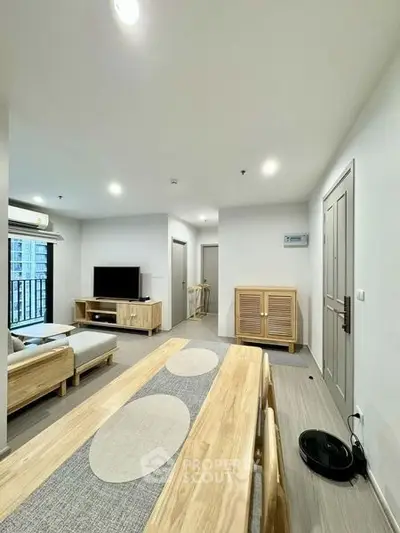 Modern living room with wooden furniture and sleek design