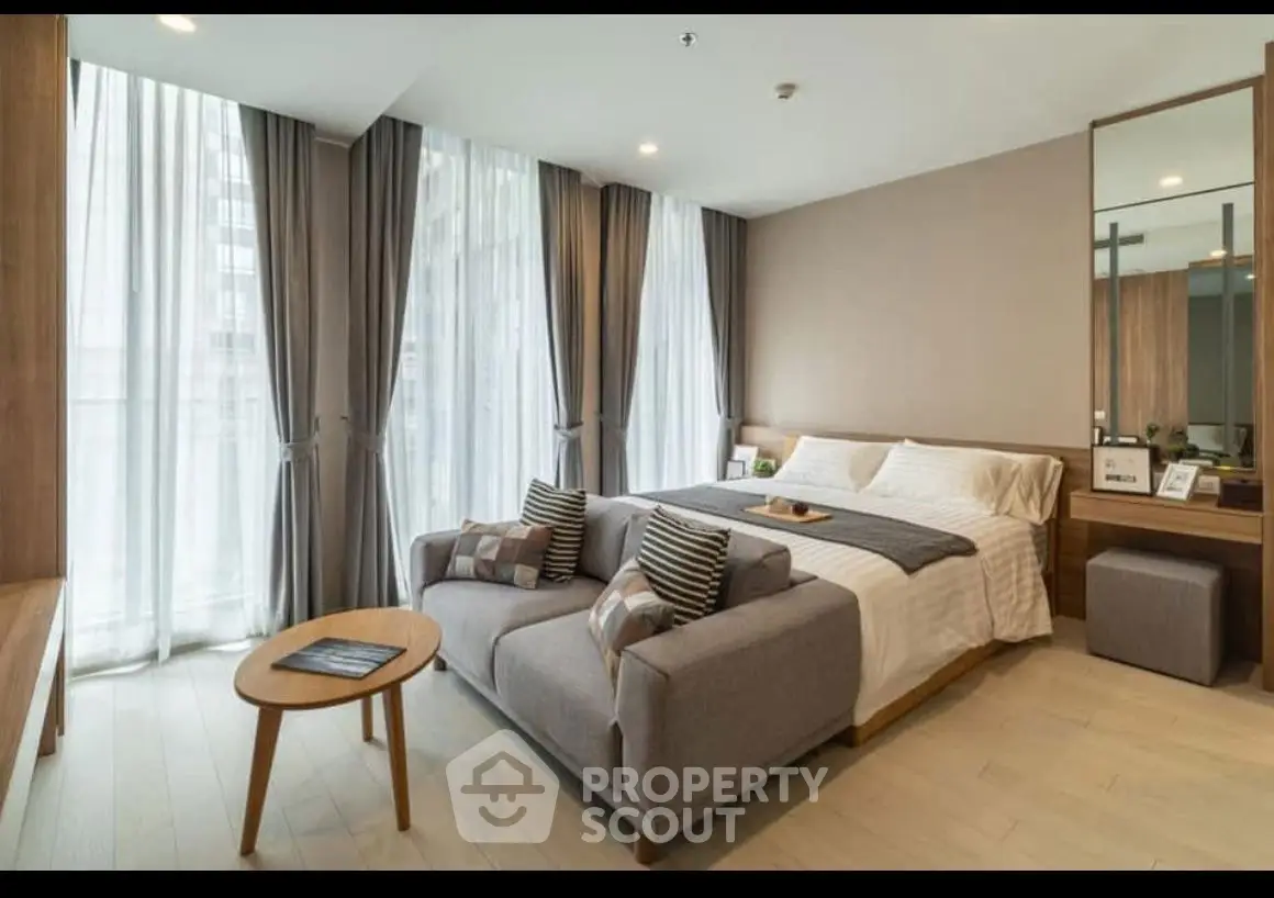 Luxurious modern bedroom with large windows and elegant decor
