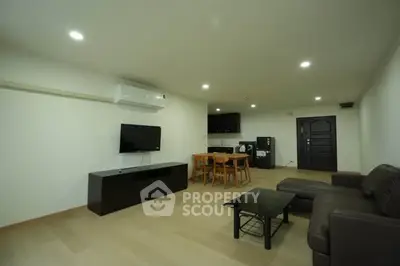 Spacious modern living room with sleek furniture and open layout