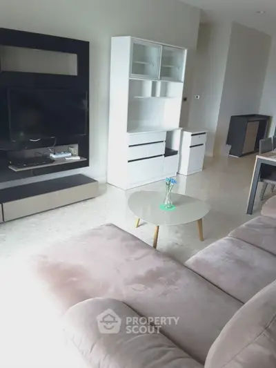 Modern living room with plush sofa and sleek entertainment unit
