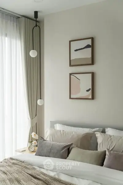 Elegant bedroom with modern decor and natural light