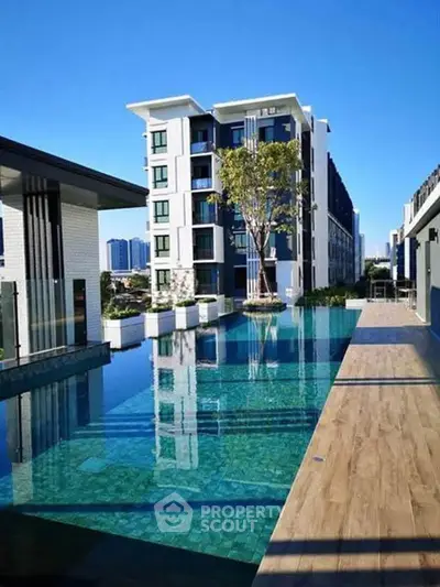 Luxurious condominium with stunning pool and modern architecture in prime location.