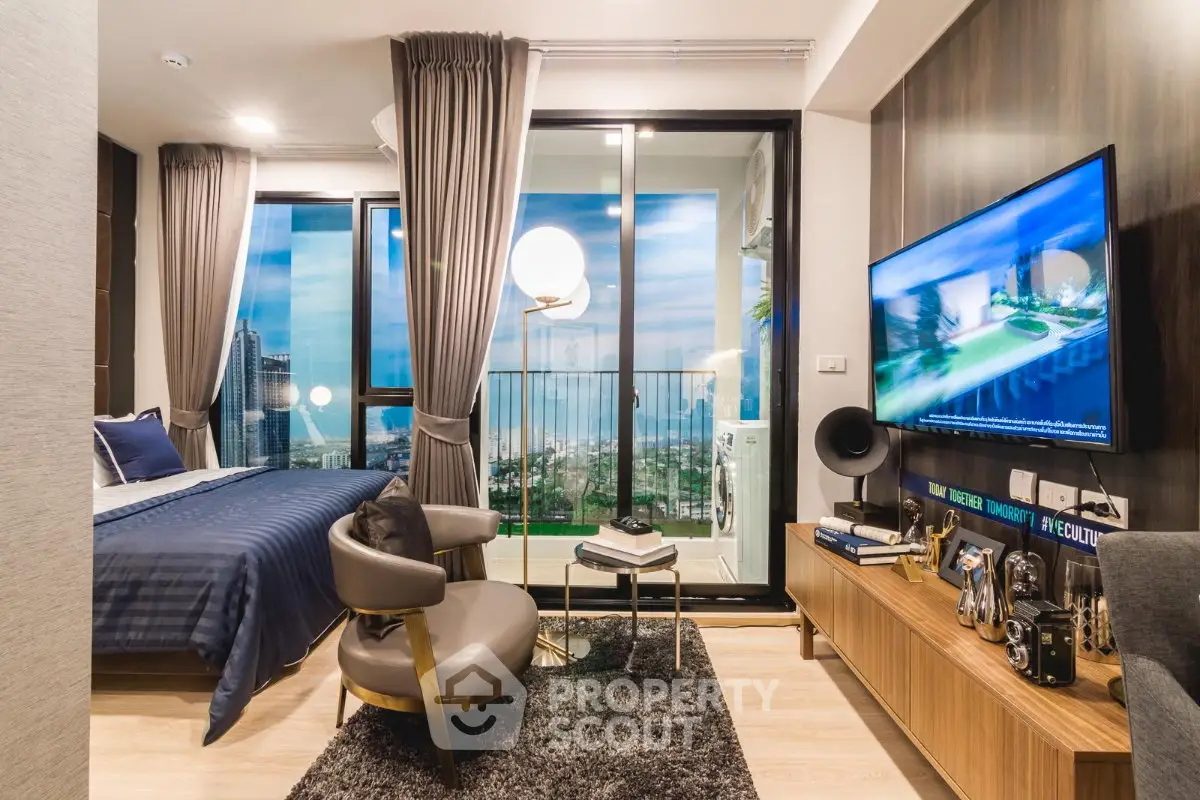 Luxurious modern living room with stunning city view from balcony, elegant decor and cozy ambiance.