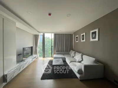 Spacious modern living room with large windows and elegant decor