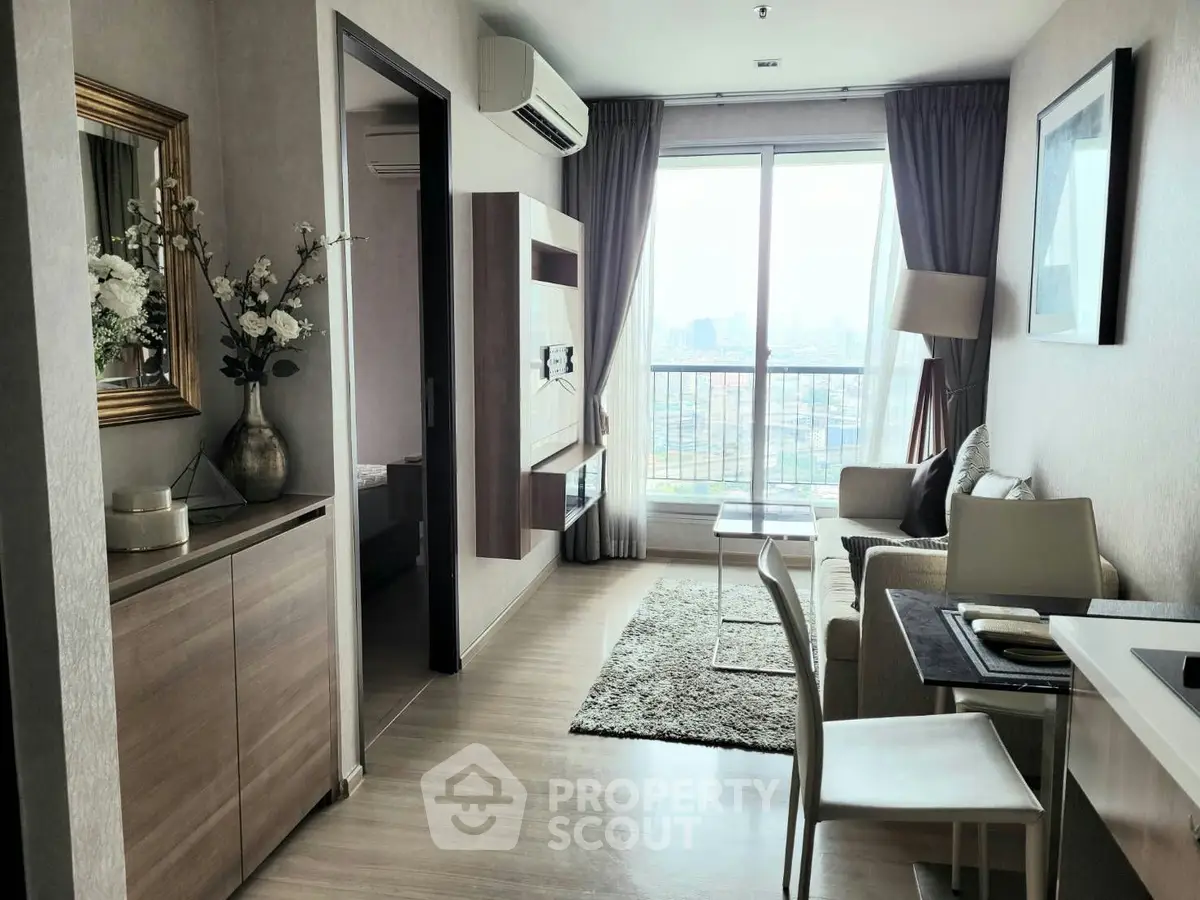 Modern living room with city view, elegant decor, and cozy seating area in a high-rise apartment.