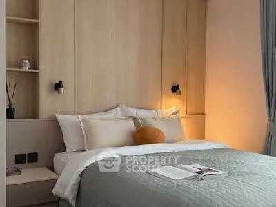 Cozy modern bedroom with stylish lighting and neutral decor