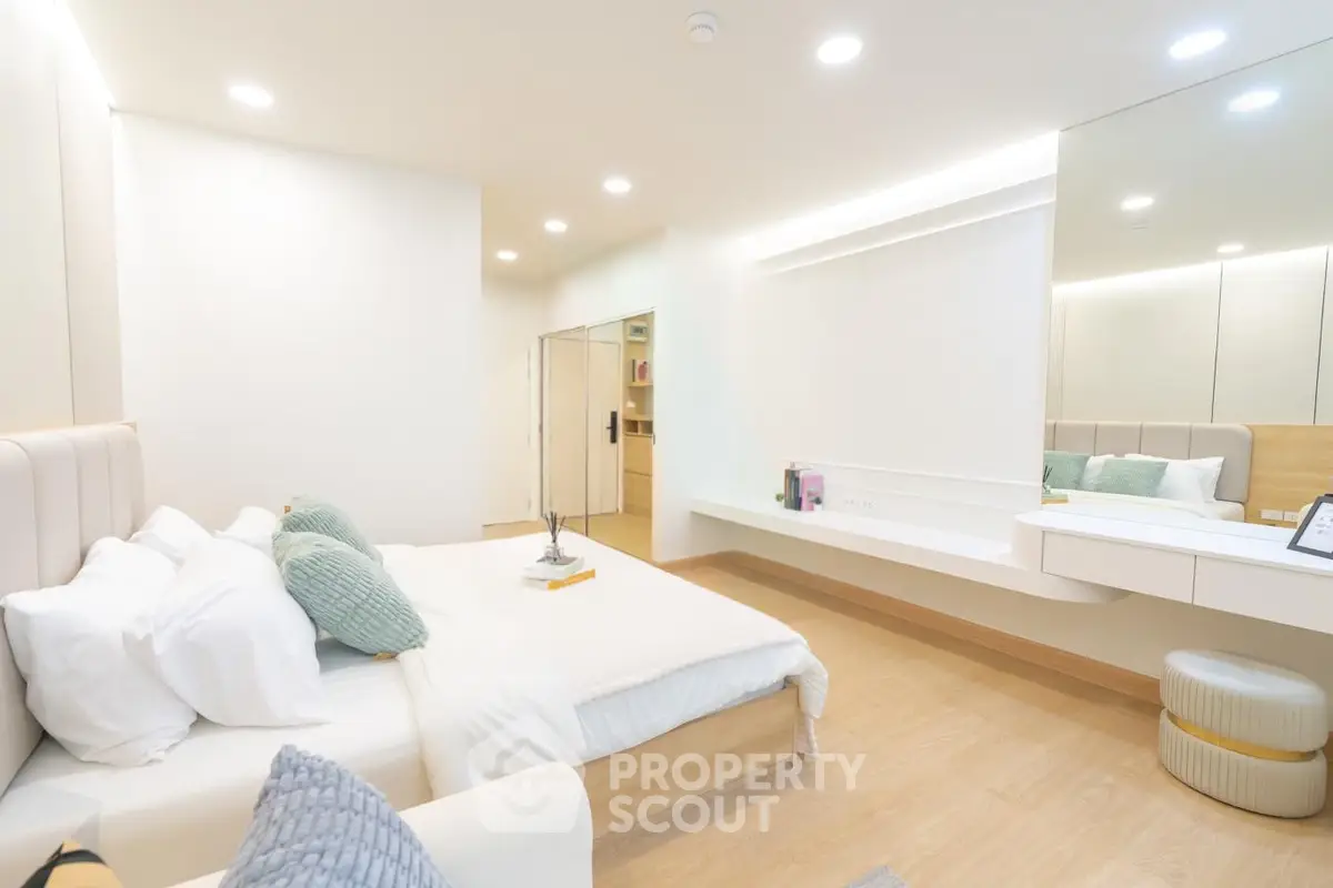 Luxurious modern bedroom with elegant decor and ample natural light