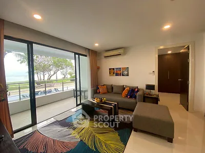 Spacious living room with modern decor and stunning balcony view