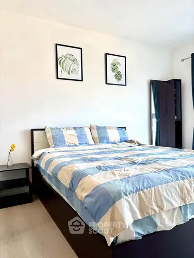 Cozy bedroom with modern decor and stylish framed artwork