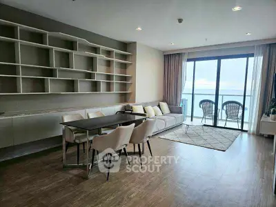 Spacious living room with ocean view and modern furnishings