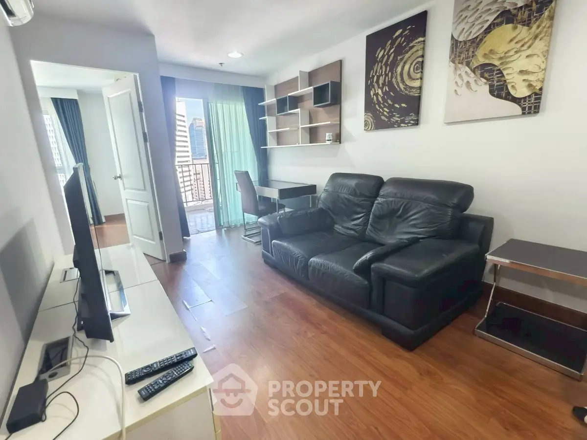 Modern living room with leather sofa and balcony view in urban apartment