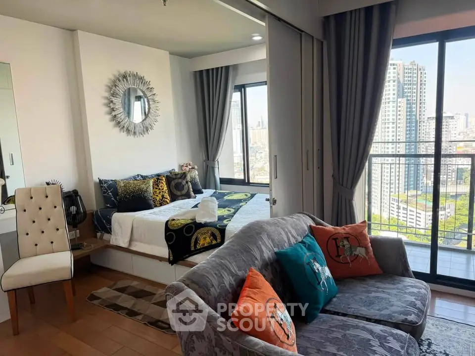 Stylish modern living room with balcony view in high-rise apartment