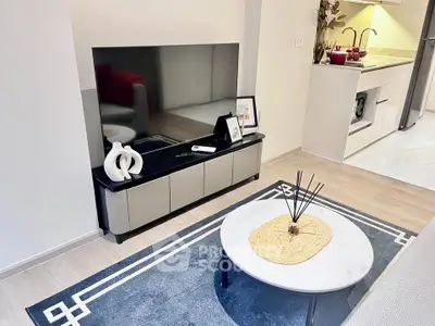 Modern living room with sleek TV stand and stylish decor in a contemporary apartment.