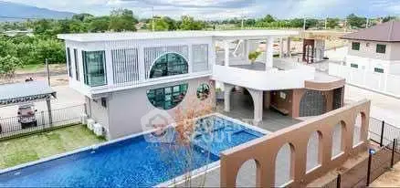 Stunning modern property with pool and unique architectural design.