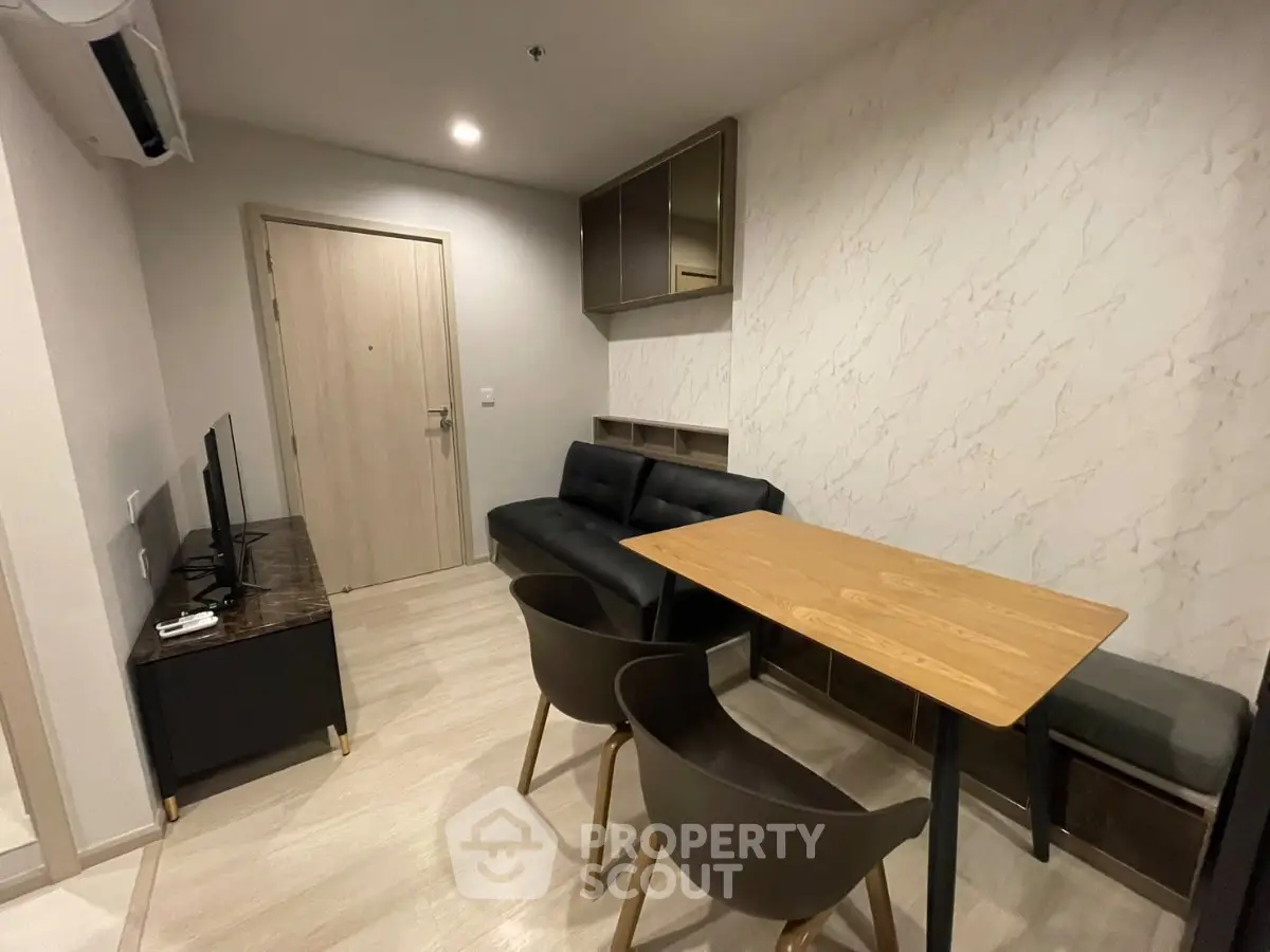 Modern living room with sleek furniture and stylish decor in a contemporary apartment.