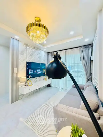 Luxurious living room with elegant chandelier and modern decor