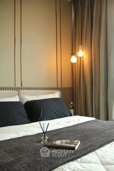 Cozy bedroom with elegant lighting and modern decor