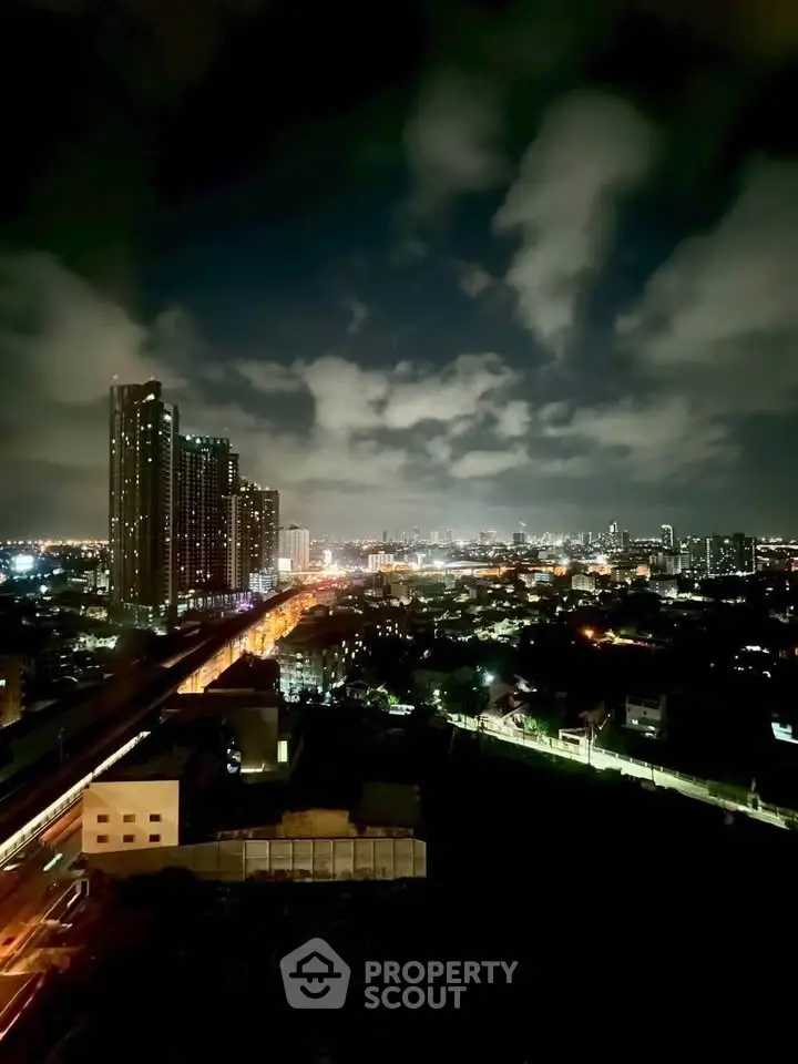 Stunning night cityscape view with illuminated skyline and towering buildings.