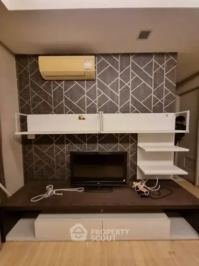 Modern living room with stylish wall design and built-in shelving unit