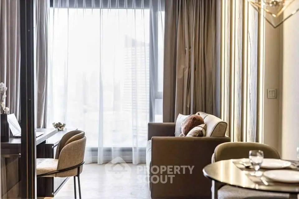 Elegant living room with modern decor and large window view