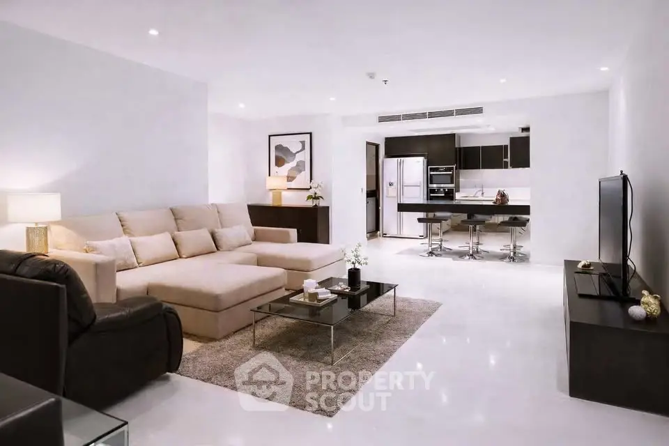 Spacious modern living room with open kitchen and elegant decor