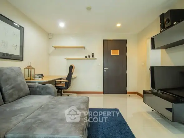 Modern living room with cozy sofa and sleek entertainment setup