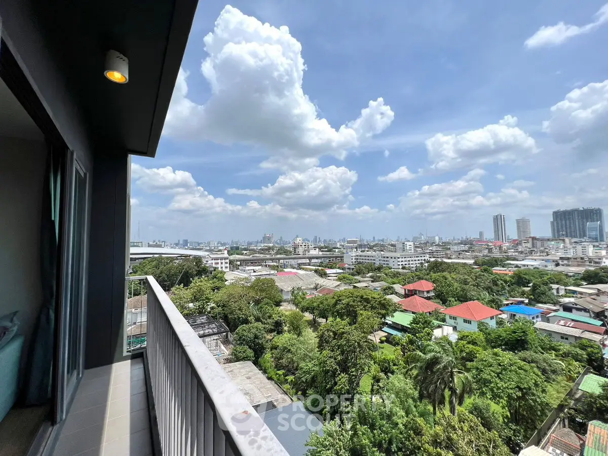 Stunning cityscape view from high-rise balcony with lush greenery and skyline