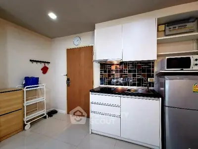 Modern kitchen with sleek cabinets and stainless steel appliances