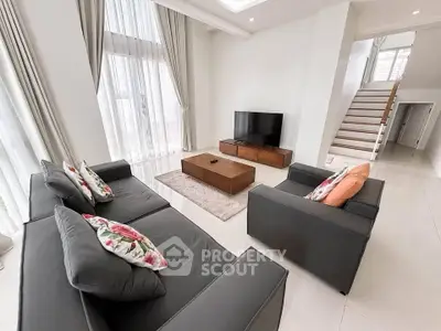 Spacious modern living room with high ceilings and elegant decor