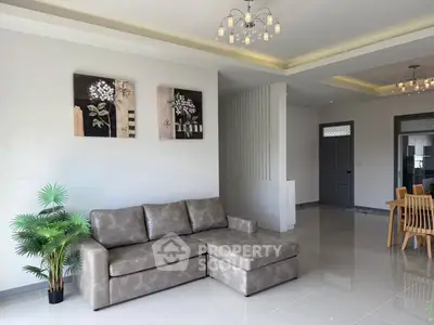 Spacious modern living room with elegant decor and ample natural light