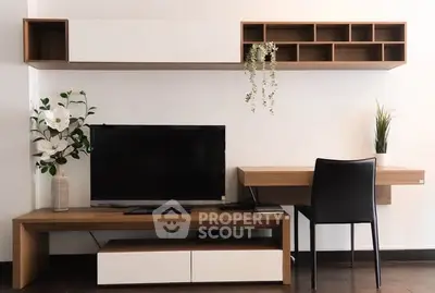 Modern living room with sleek TV stand and stylish desk setup