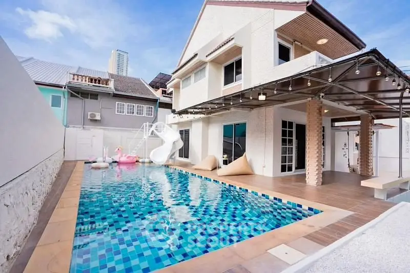 Stunning modern home with private pool and slide, perfect for family entertainment.