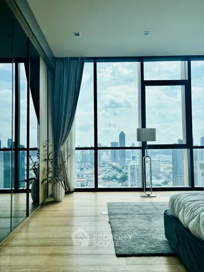 Luxurious bedroom with floor-to-ceiling windows offering stunning city skyline views.