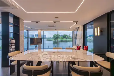 Luxurious dining area with stunning waterfront view and modern decor